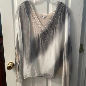 Flowy blouse lined gray and white with taupe accents. Slight shoulder flaw